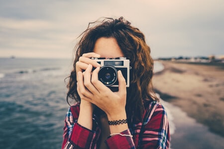 Photographer using a film camera.